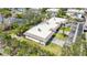 An aerial view of a condo/townhouse featuring a well-maintained exterior and a private driveway at 534 Sutton Pl, Longboat Key, FL 34228
