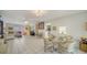 Bright living room featuring tile floors, comfortable seating, and art decorations throughout the home at 534 Sutton Pl, Longboat Key, FL 34228