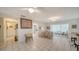 Open-concept living area with tile floors and multiple seating options at 534 Sutton Pl, Longboat Key, FL 34228