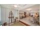 Bright living room with an easel, and view of dining area, tile floors, and comfortable seating at 534 Sutton Pl, Longboat Key, FL 34228