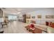 Spacious living room featuring tile floors, white sofa, and multiple seating areas at 534 Sutton Pl, Longboat Key, FL 34228