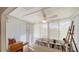 Sun Room with natural light, view of the backyard, and books and personal items at 534 Sutton Pl, Longboat Key, FL 34228