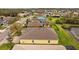 An aerial perspective showcasing the property's proximity to a serene lake at 5342 98Th E Ave, Parrish, FL 34219