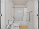 Well-lit bathroom showcasing a toilet and a tub with white tile surround and shower curtain at 5342 98Th E Ave, Parrish, FL 34219