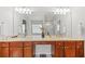 Bathroom featuring a dual vanity, a large mirror, and a separate shower at 5342 98Th E Ave, Parrish, FL 34219