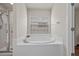 Bathroom showcasing a large soaking tub and a window for natural light at 5342 98Th E Ave, Parrish, FL 34219