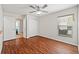 Spacious bedroom with wood-look floors, a ceiling fan, and two closets at 5342 98Th E Ave, Parrish, FL 34219