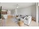 Comfortable living room with tile floors, a ceiling fan, and an open floor plan at 5342 98Th E Ave, Parrish, FL 34219