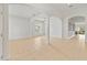Spacious and bright living room with neutral walls, tile flooring, and arched doorways at 5342 98Th E Ave, Parrish, FL 34219