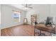 Office with hard wood floors, natural light, computer desk and a wooden bookcase and chair at 5342 98Th E Ave, Parrish, FL 34219