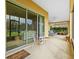 Covered patio with seating and a view to a large backyard at 5342 98Th E Ave, Parrish, FL 34219