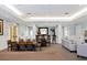 Spacious community room featuring a dining table, bar seating, and stylish decor for social gatherings at 5700 Bentgrass Dr # 209, Sarasota, FL 34235