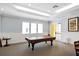 Bright game room with a pool table, ample lighting, and neutral tones, creating a fun atmosphere at 5700 Bentgrass Dr # 209, Sarasota, FL 34235