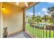Screened lanai overlooking a pool and lush greenery, offering a serene outdoor living space at 5700 Bentgrass Dr # 209, Sarasota, FL 34235