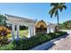 Las Palmas Luxury Condominiums sign with lush landscaping at 5700 Bentgrass Dr # 209, Sarasota, FL 34235