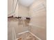 Walk-in closet features wire shelving and neutral paint at 5700 Bentgrass Dr # 209, Sarasota, FL 34235