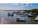 This aerial view captures the boat docks, piers and harbor, showcasing water access and views in a coastal setting at 6156 41St E St, Bradenton, FL 34203