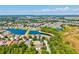 An aerial view of the community featuring picturesque ponds and beautiful single-Gathering homes, providing a serene setting at 6156 41St E St, Bradenton, FL 34203