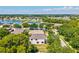 Beautiful home with waterfront views, lush landscaping, and a screened-in lanai at 6156 41St E St, Bradenton, FL 34203