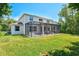 Spacious backyard with a screened lanai, offering a private and serene outdoor retreat at 6156 41St E St, Bradenton, FL 34203