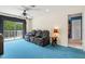 Comfortable bonus room equipped with reclining seating, balcony access, creating a perfect retreat for relaxation at 6156 41St E St, Bradenton, FL 34203