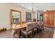 Stately dining room with large table, chandelier, and adjacent kitchen view at 6156 41St E St, Bradenton, FL 34203