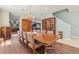 Elegant dining room with a large table, china cabinet, and open floor plan at 6156 41St E St, Bradenton, FL 34203