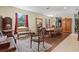 Spacious dining room featuring a wooden table, chandelier, and large mirror at 6156 41St E St, Bradenton, FL 34203
