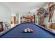 Billiard table in game room, open layout to kitchen and ample space for entertainment and relaxation at 6156 41St E St, Bradenton, FL 34203
