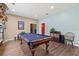 Spacious game room featuring a classic billiard table and decorative accents, perfect for entertaining guests at 6156 41St E St, Bradenton, FL 34203