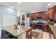 Kitchen features granite countertops, stainless steel appliances, and a center island with barstool seating at 6156 41St E St, Bradenton, FL 34203