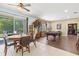 Entertaining area featuring a pool table, dining table, and sliding glass doors to outdoor patio at 6156 41St E St, Bradenton, FL 34203