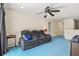 Comfortable living room features plush reclining seating and a ceiling fan for added relaxation at 6156 41St E St, Bradenton, FL 34203