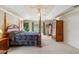 The main bedroom has a four-poster bed and access to a private balcony with scenic views at 6156 41St E St, Bradenton, FL 34203