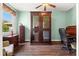 Bright office space featuring a large wine cabinet and a rolltop desk creating an ideal workspace at 6156 41St E St, Bradenton, FL 34203