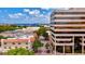 Street view featuring commercial buildings, mature trees, and the cityscape, highlighting urban development at 6156 41St E St, Bradenton, FL 34203