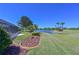 Well-maintained backyard with beautiful landscaping and peaceful lake views at 6511 Turners Gap Rd, Bradenton, FL 34203