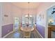 Cozy dining room with chandelier and view of the pool area through the glass doors at 6511 Turners Gap Rd, Bradenton, FL 34203