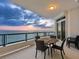 Balcony with table, chairs, and ocean view at 655 Longboat Club Rd # 16B, Longboat Key, FL 34228