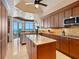 Gourmet kitchen with marble countertops, custom cabinetry, and ocean views at 655 Longboat Club Rd # 16B, Longboat Key, FL 34228