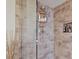Close up of bathroom featuring a tiled shower with a built in toiletry shelf at 7223 Wood Creek Dr # 22, Sarasota, FL 34231