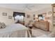 Cozy bedroom with neutral decor, ample natural light, and a comfortable workspace at 7223 Wood Creek Dr # 22, Sarasota, FL 34231