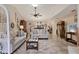 Spacious living room with tile flooring, comfortable sofas, and an open layout to the dining area at 7223 Wood Creek Dr # 22, Sarasota, FL 34231