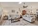 Spacious living room featuring stylish furniture, neutral tones, and ample natural light at 7223 Wood Creek Dr # 22, Sarasota, FL 34231