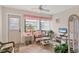 Relaxing sunroom features wicker furniture, a ceiling fan, and natural light for year-round enjoyment at 7223 Wood Creek Dr # 22, Sarasota, FL 34231