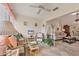 Bright sunroom with wicker furniture, potted plants, and access to a view of the outdoors at 7223 Wood Creek Dr # 22, Sarasota, FL 34231