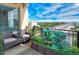 Relaxing balcony with comfortable seating, lush greenery, and scenic city views, perfect for enjoying outdoor living at 750 N Tamiami Trl # 604, Sarasota, FL 34236