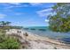 Beautiful beach with white sand, blue water and clear skies, perfect for relaxation at 750 N Tamiami Trl # 604, Sarasota, FL 34236