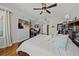 Bedroom with hardwood floors, a ceiling fan, natural light, and a workspace at 750 N Tamiami Trl # 604, Sarasota, FL 34236