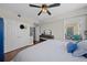 This bedroom is complemented by a ceiling fan, closet, and a window overlooking the outdoor scenery at 750 N Tamiami Trl # 604, Sarasota, FL 34236